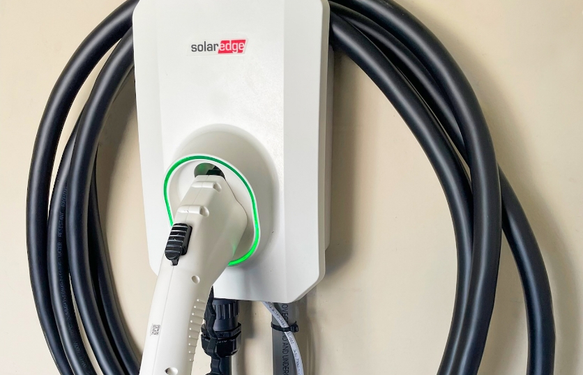 A wall-mounted electric vehicle charger.