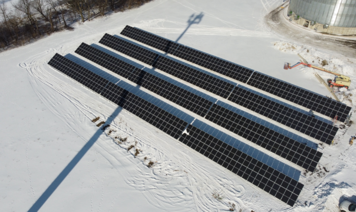 Solar ground mount array in a snowy field.