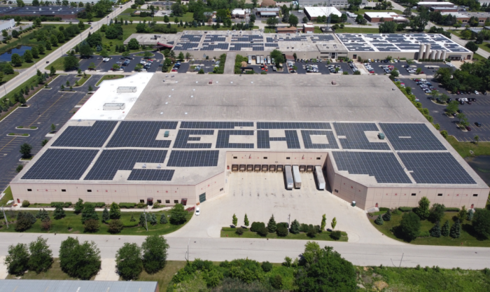 A large scale solar system with the company name ECHO spelled out with solar panels.