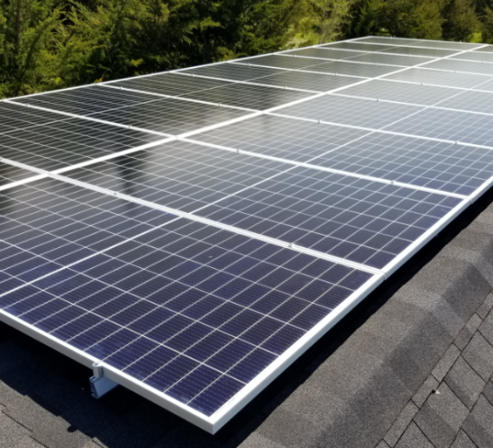 A close up picture of solar panels on a roof.